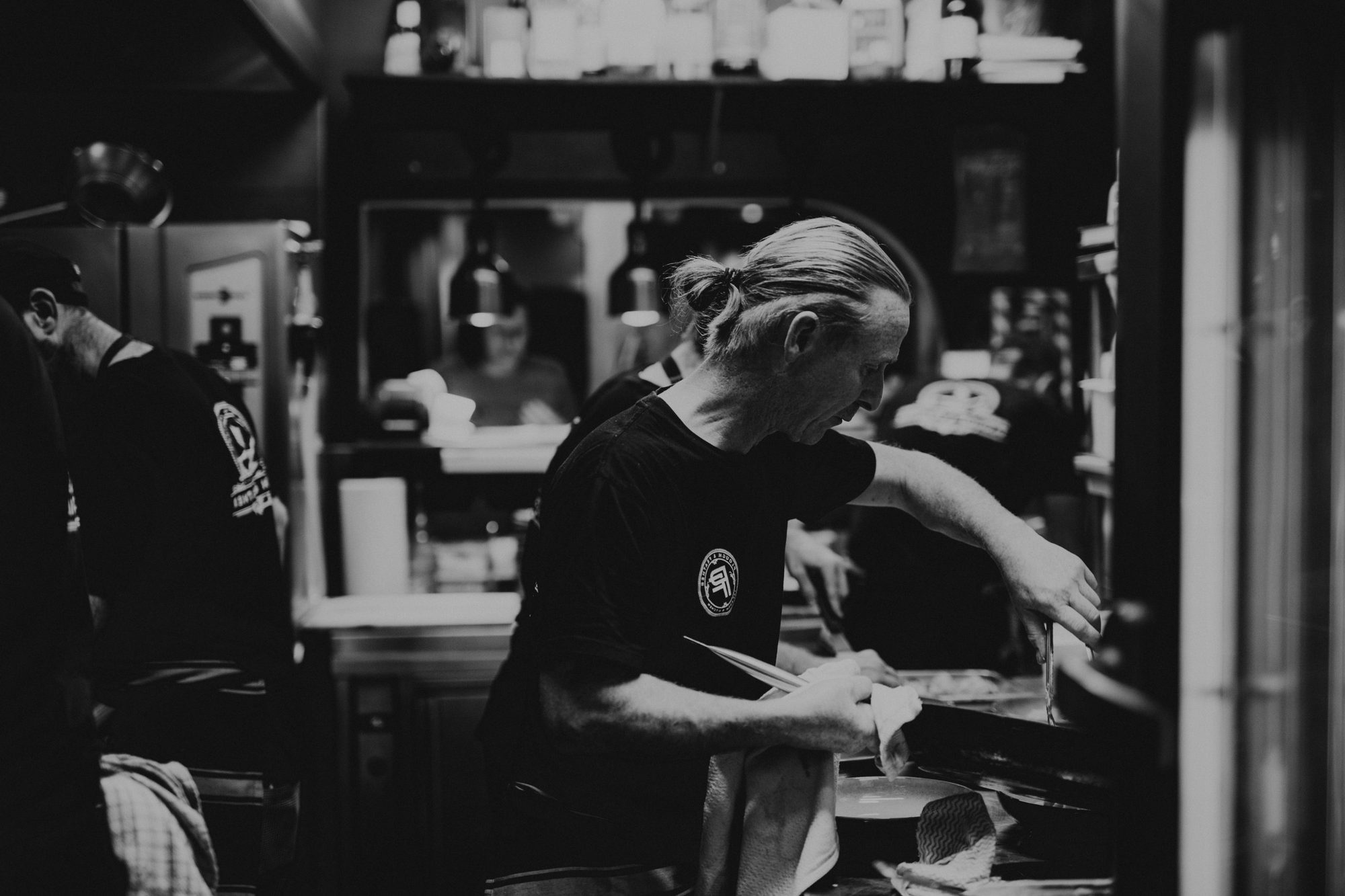 Chef Colin Ashton plating up in the kitchen